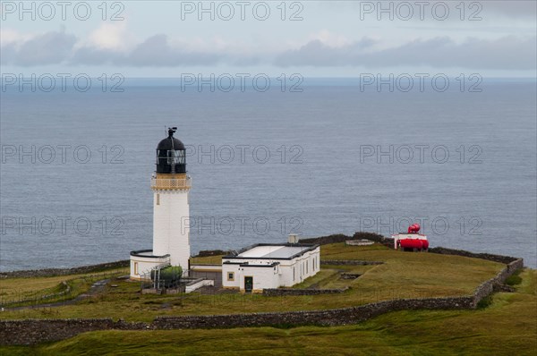 View of lighthouse and foghorn on coastal clifftop