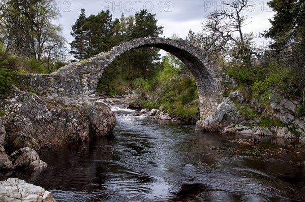 18th century stone packhorse bridge over the river