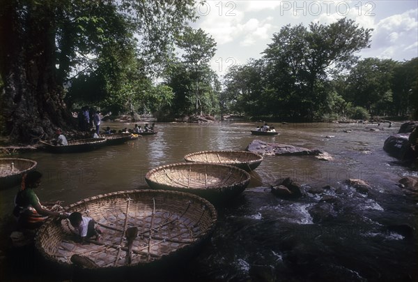 Coracle Oarsmen awaiting Tourist in Hogenakkal