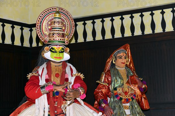 Fully made up and costumed Kathakali dancers performing