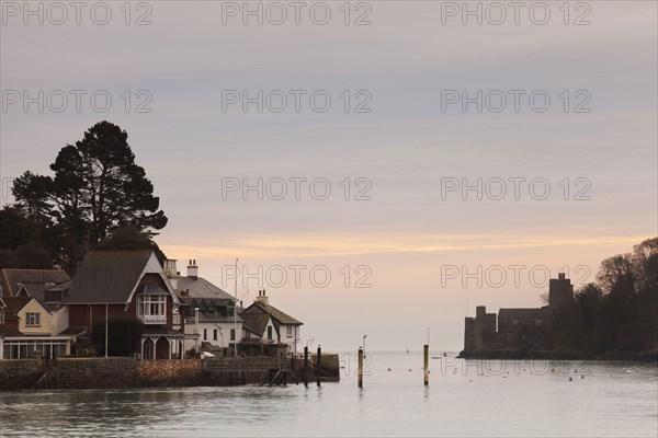 View of harbour entrance with Dartmouth Castle and Royal Dart Yacht Club at sunrise