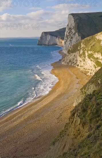 View of chalk cliffs and shingle beach