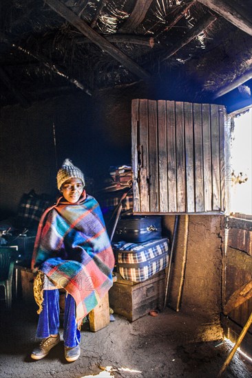 Woman in hut