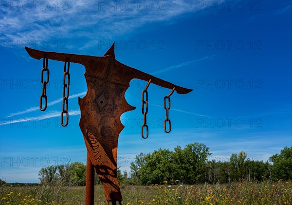 Depiction of a rusty scarecrow on the Ferropolis art trail in Graefenhainichen