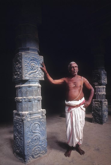 A Priest standing in Kampaheswarar Temple at Thirubuvanam