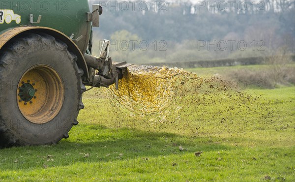 Slurry tanker spreading manure on grassland near Longridge