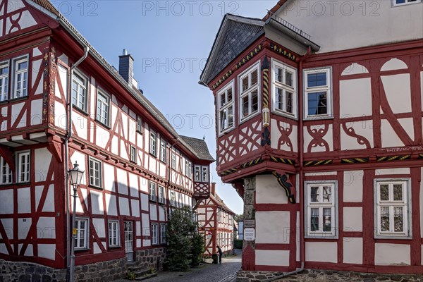 Medieval half-timbered houses with bay windows at the corner of the house