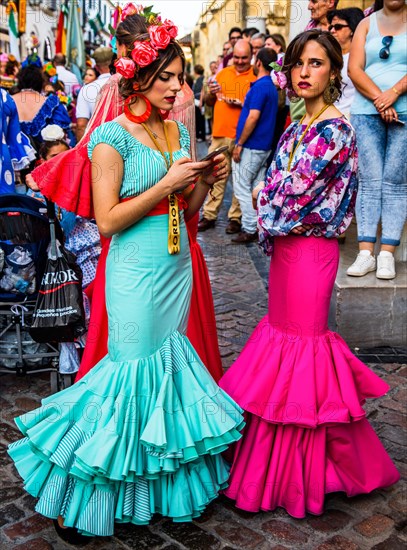 Women in flamenco costumes at the folk festival