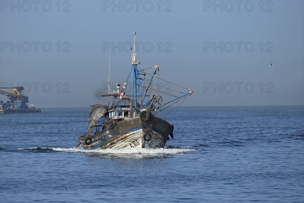 Fishing boat with beam trawls at sea