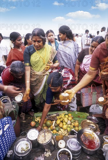 Pooja or Puja on the steps of River Kaveri or Cauvery in Srirangam