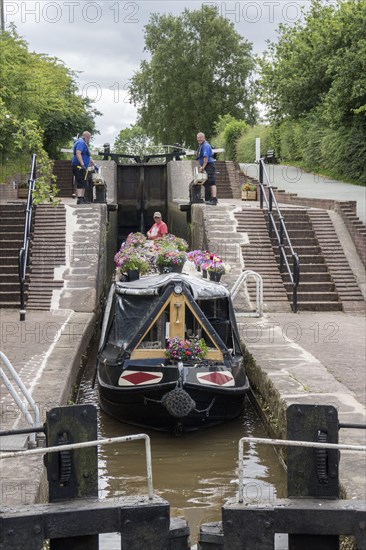 Canal or narrowboat on the Llangollen branch of the Shropshire Union Canal passes through the village of Grindley Brook using the 3 Grindley Brook locks