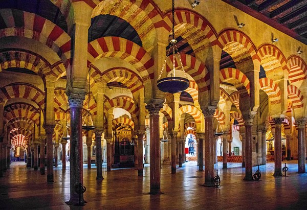 Forest of columns with alternating use of brick and stone and red and white paint