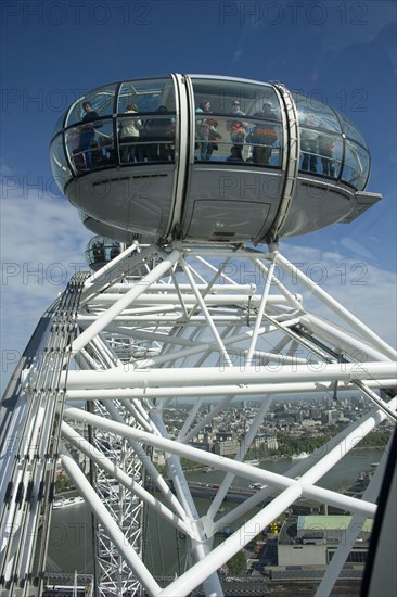 Ferris wheel passenger pods overlooking the city river