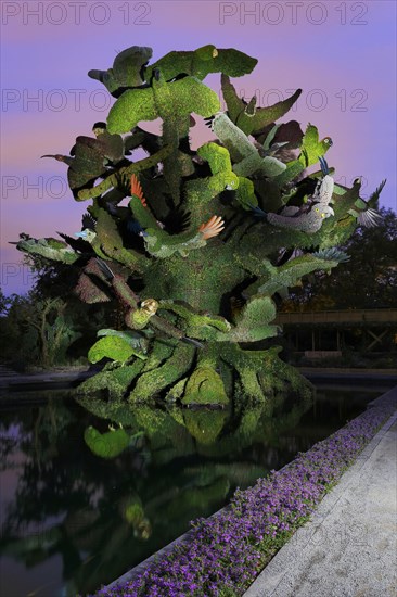 Light painting photography of a garden sculpture