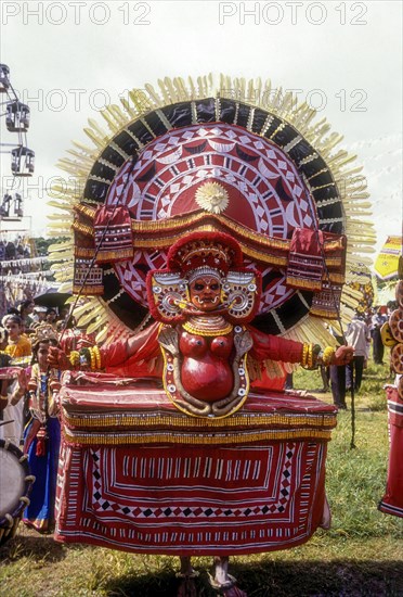 Theyyam dancer in Kavadiyattam in Athachamayam celebration in Thripunithura during Onam near Ernakulam