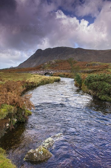 View of river and bridge in upland valley