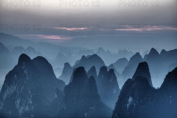 View of limestone karst formations at sunrise