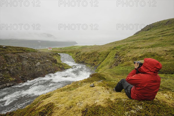 Hiker using binoculars