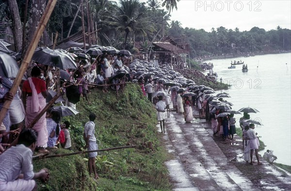 Spectators during raining with Umbrellas in Aranmula Boat race during Onam