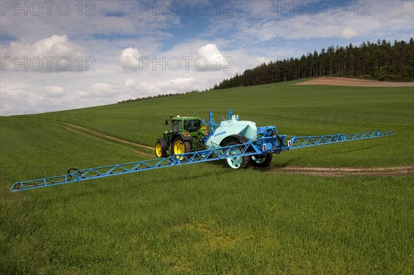 Tractor with sprayer