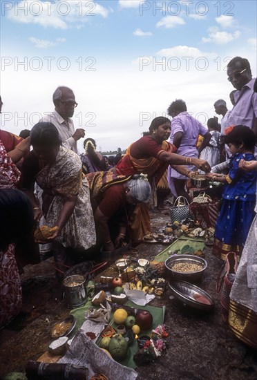 Pooja or Puja on the steps of River Kaveri or Cauvery in Srirangam