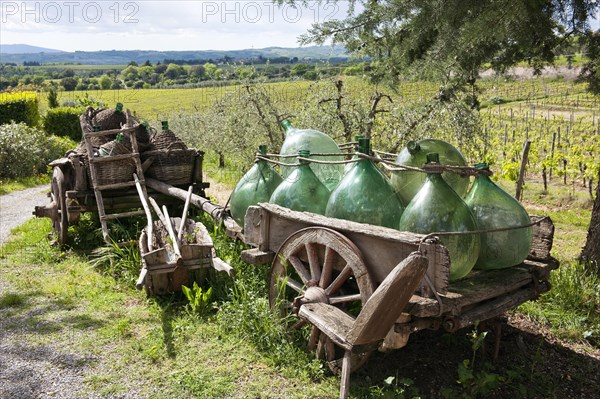 Wooden cart with wine bottles