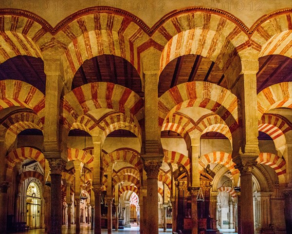 Forest of columns with alternating use of brick and stone and red and white paint