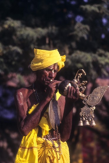 Conch blower at Nellithurai Sri Vana Badra Kali Amman Temple near Mettupalayam