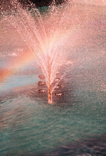 A water fountain sprinkling water in the view