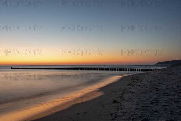 Sunset with breakwater on the island of Hiddensee