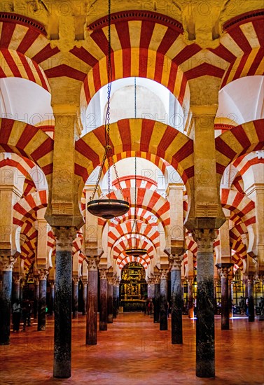 Forest of columns with alternating use of brick and stone and red and white paint