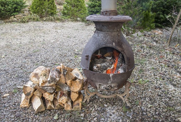 Wood stove burning split logs