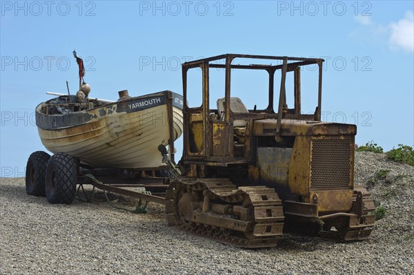 Tractor lands fishing boat on beach