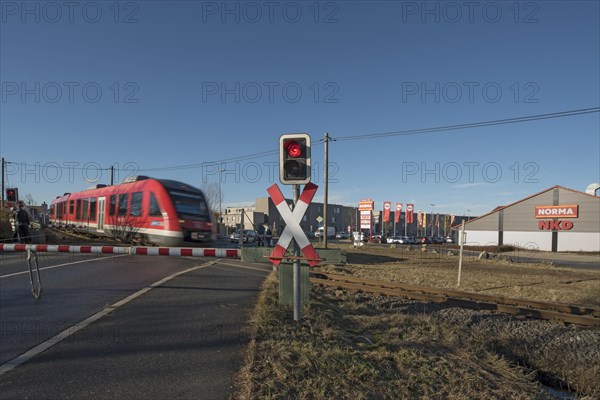 Passing train at a level crossing with barriers