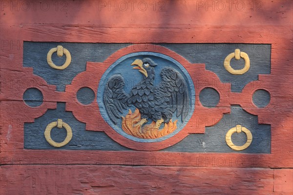 Wood carving with firebird at the historic Amthof in Bad Camberg