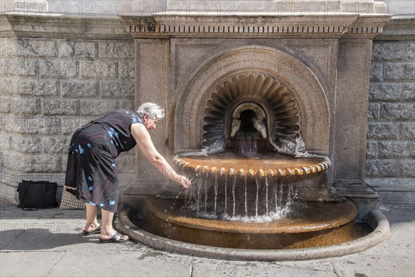 Capturing the hot sulphur water from the La Bollente spring in the centre of Acqui Terme