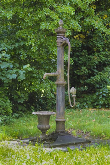 Old fountain with hand pump