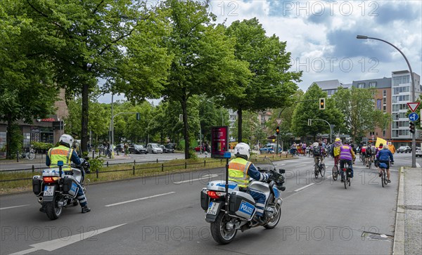 Berlin police escorting a bicycle parade on Kurfuerstendamm