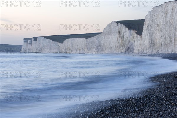 View of the chalk cliffs on the coast at dusk
