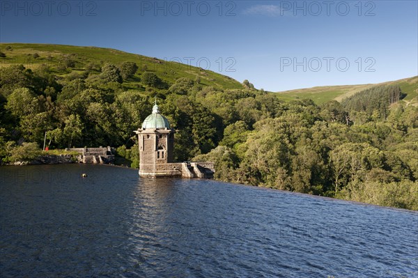 Dam spillway and pump house at reservoir
