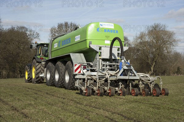 Slurry tanker farmer with Spreadwise slurry injector applying slurry to grassland