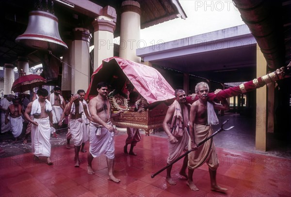 The Urchava deity is borne aloft in a Palanquin at the Tirumala Devaswom in Kochi