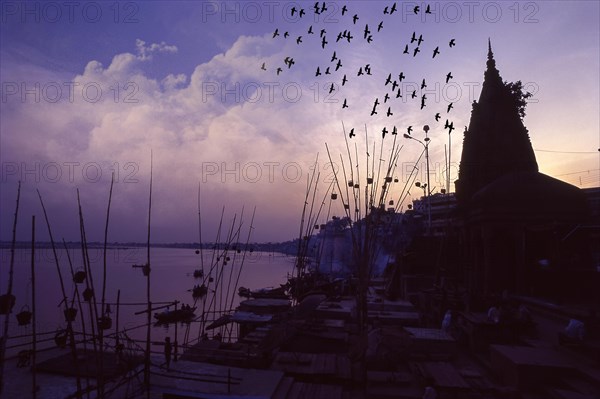 Akash deep oil Lamps in wicker baskets suspended on bamboo poles are said to be light the path of the dead to heaven at Manikarnika Ghat