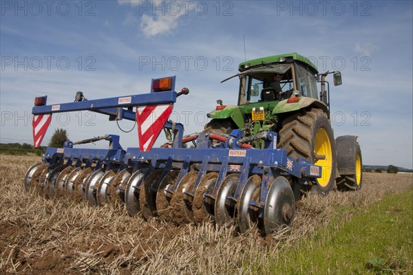 Tractor with disc harrows