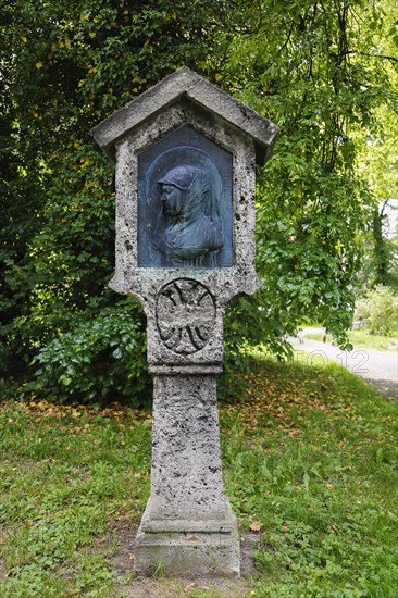 Stone stele with woman's face