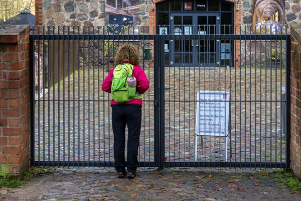 Visitor standing in front of the entrance to Chorin Monastery