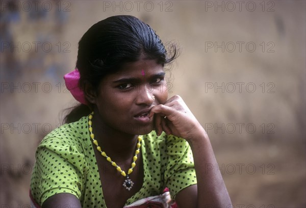 Betta Kurumba tribal girl sitting the tribal village