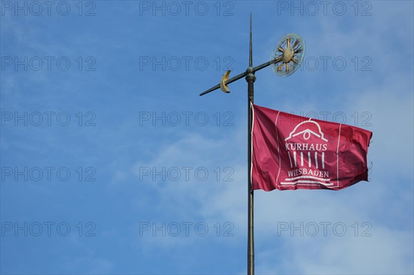 Weather vane with flag on the roof of the spa hotel in Wiesbaden