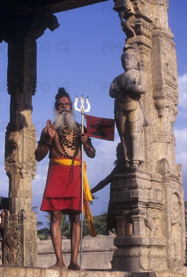 A Sadhu standing in Nandhi mandapam at Thanjavur Brihadeeswarar