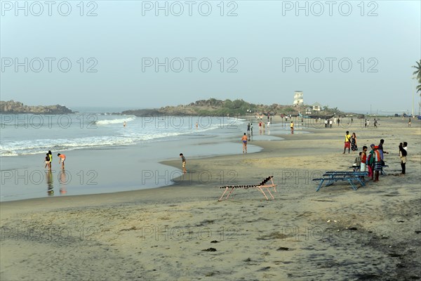 Holidaymakers on the beach of Kovalam